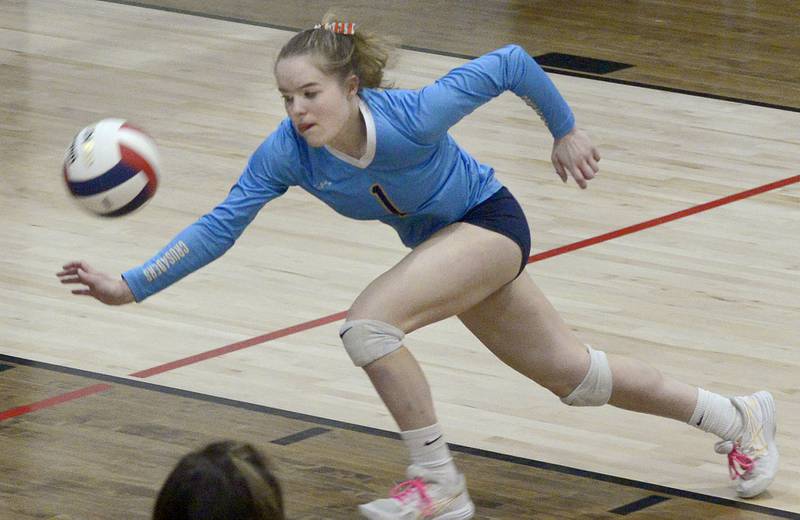 Marquette’s Emma Rinearson chases the ball down to make a save in the 2nd set against Lexington Tuesday at the Woodland Sectional.