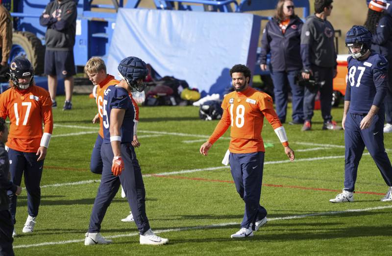 Chicago Bears quarterback Caleb Williams (18) stretches during a training session in Ware, England, Thursday, Oct. 10, 2024, ahead of the game between the Chicago Bears and the Jacksonville Jaguars at Tottenham Hotspur Stadium on Sunday. (AP Photo/Sean Ryan)