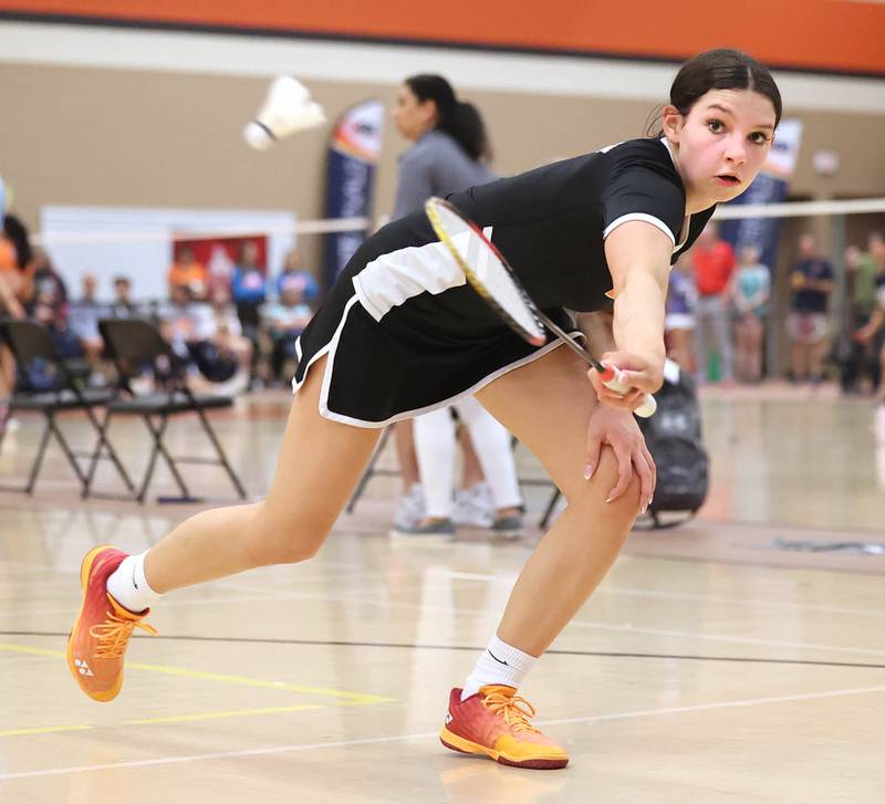 DeKalb’s Gwen Pfile hits a backhand Friday, May 12, 2023, during her match against  	Carissa Chen from the Illinois Math and Science Academy in the IHSA State Badminton Finals at DeKalb High School.