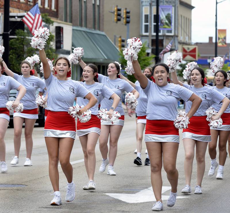 The Streator High School cheerleaders make their way down Main Street on Sunday, July 2, 2023, during the Streator Independence Day parade.