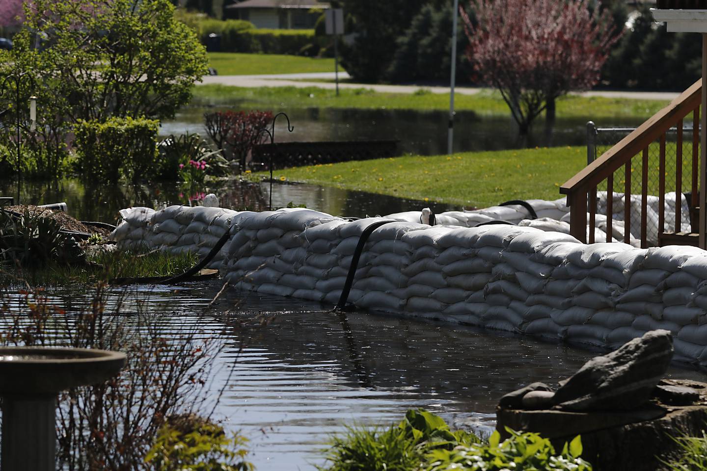Sandbags protect a home in Holiday Hills  as flooding continues on the Fox River on Wednesday, April 22, 2026.