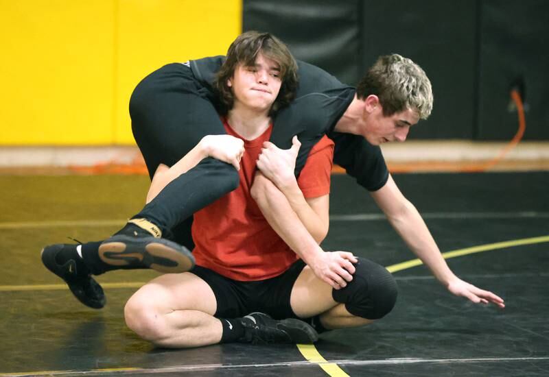 Sycamore wrestler Gabriel Crome (bottom) works with teammate Jaden Cochran Tuesday, Jan. 31, 2023, during practice at Sycamore High School.