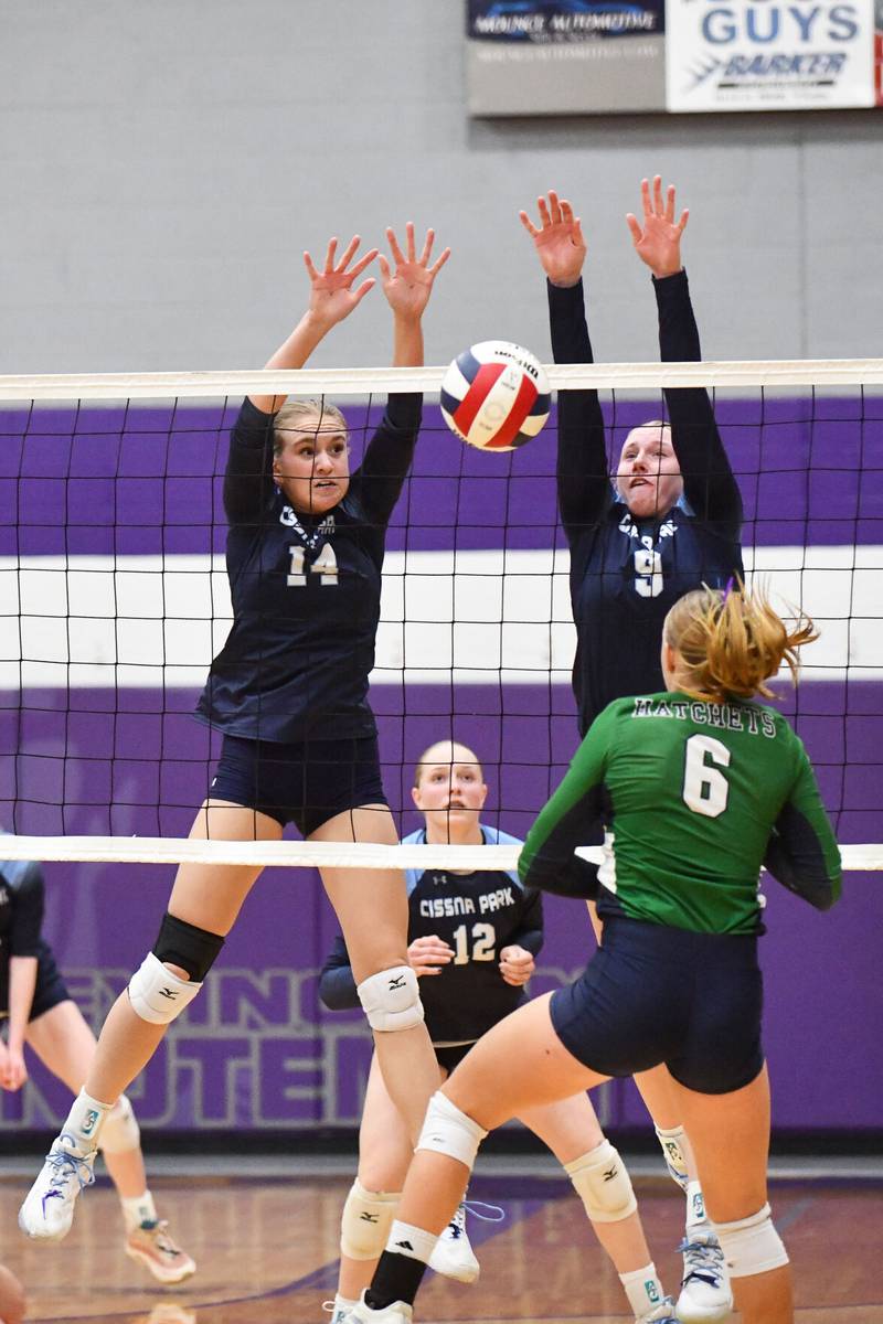 Cissna Park's Savannah Kaeb (14) and Addison Lucht block a hit Monday night during the Timberwolves' victory in two sets, 20-23, 27-25, over Windsor/Stewardson-Strasburg in the IHSA Class 1A Lexington Super-Sectional.