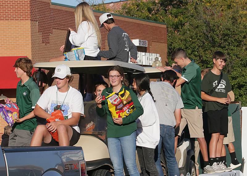 St. Bede golf team players ride in the Homecoming parade on Friday, Sept. 30, 2022 downtown Peru.