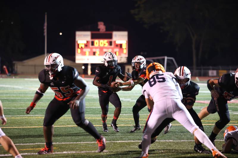 Bradley-Bourbonnais quarterback Ellis Johnson hands the ball off to Kyren Edmon during the Boilermakers' victory over Stagg on Friday, Sept. 26, 2025.