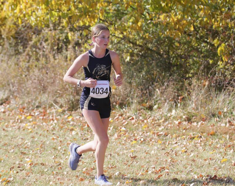 Marquette's Morgan Nelson runs in the Class 1A Regional Cross Country gils race on Saturday, Oct. 22, 2022 at the Seneca FFA Farm in Marseilles.