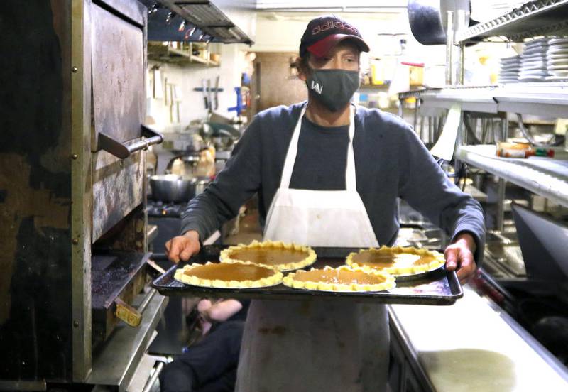 File photo - Chef Eric Griffiths brings some pumpkin pie to the oven Wednesday, Nov. 18 at Hillside Restaurant in DeKalb.