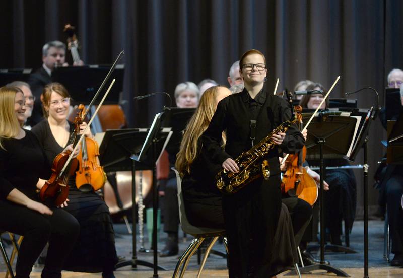 Rileigh Wren smiles after playing the saxophone with the Clinton Symphony Orchestra during the Family Concert on Sunday, Feb. 23, 2025 in the Morrison High School Auditorium.