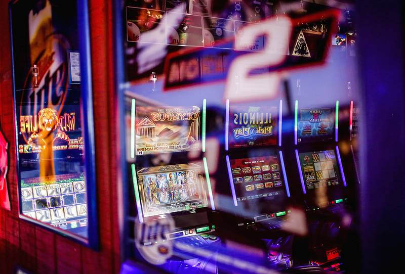 The video gambling area at Izzy's in Joliet is reflected in picture frames on Tuesday, April 29, 2014.