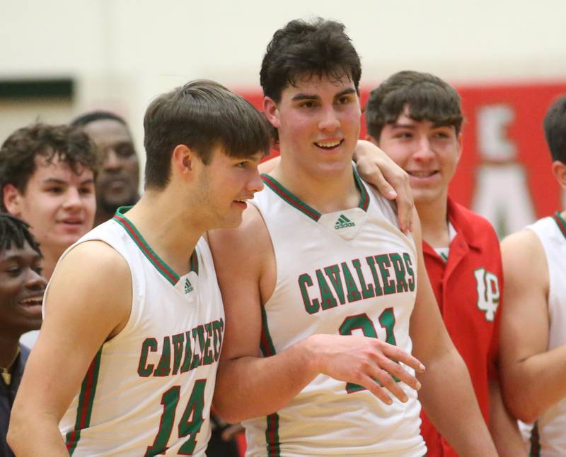 L-P's Brendan Boudreau congratulates teammate Josh Senica after scoring 1000 points on Tuesday, Nov., 28, 2023 in AJ Sellett Gymnasium at L-P High School.