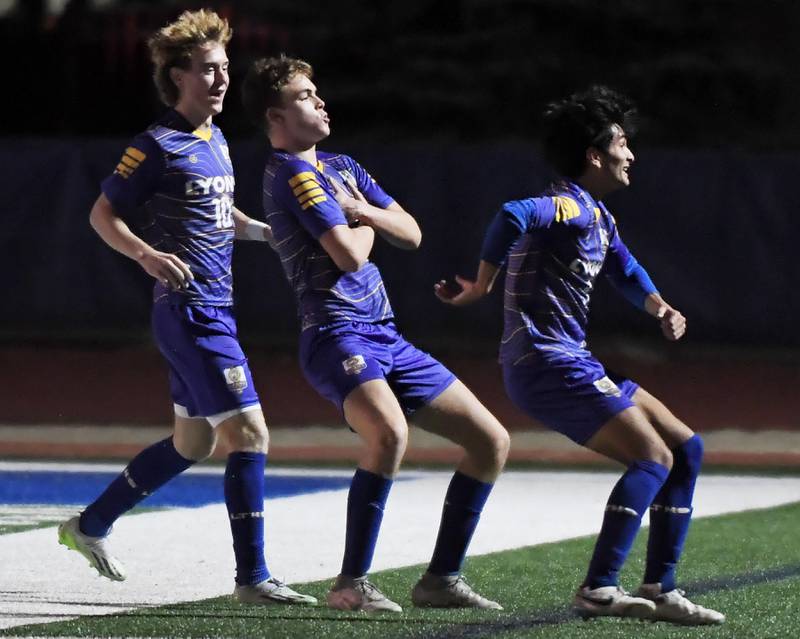 Lyons Township’s Owen Suda, middle, celebrates his first-half goal against Naperville North in the Class 3A state soccer semifinal game in Hoffman Estates on Friday, November 3, 2023. It was the only score of the game.