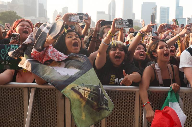 Pierce The Veil fans scream as they play one of their hit songs at Lollapalooza on Sunday, Aug. 4, 2024 in Chicago.