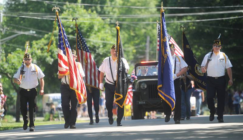 The American Legion Post 675 Color Guard, marches down Main Street in Oswego during the annual Memorial Day Parade and Service, Monday, May 29, 2023.