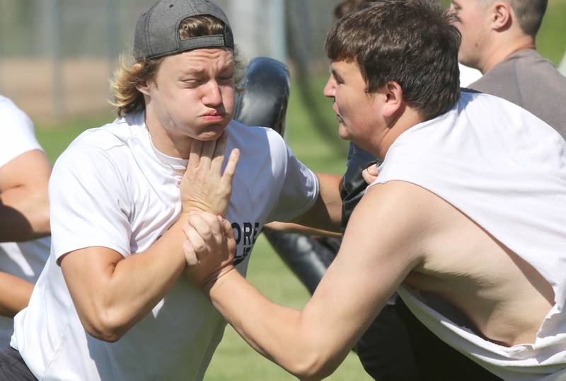 Sycamore's Caden Cowsert (left) woorks against a teammate in a defensive linemen drill Monday, June 27, 2022, during football practice at the school.