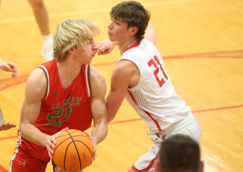 L-P's Mason Morscheiser looks to pass the ball around Streator's Brennen Stillwell on Tuesday, Jan. 13, 2026 in Pops Dale Gymnasium at Streator High School.