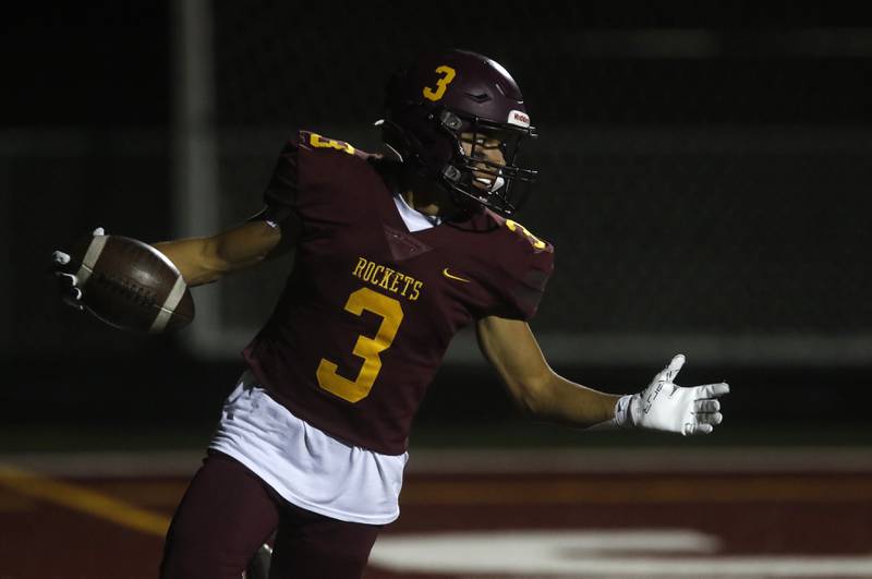 Richmond-Burton's Oscar Bonilla celebrates a touchdown catch during a Kishwaukee River Conference football game against Sandwich on Friday, Oct. 4, 2024, at Richmond-Burton High School.