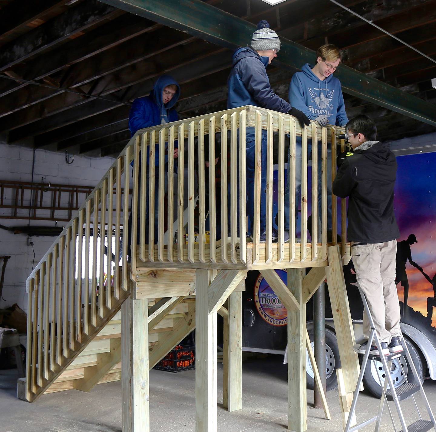 (l-r) Boy Scouts Dominic Fiedler, Morgan Schramm, Logan Cunz and Sean Liu work on Logan Cunz’s Eagle Scout project in Sugar Grove on Sunday, Feb. 13, 2022.