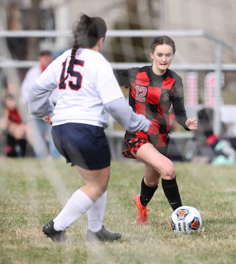 Indian Creek's Emma Turner approaches the DePue goal as Alyssa Lopez tries to defend during their game Tuesday, April 5, 2022, at Indian Creek Middle School in Waterman.