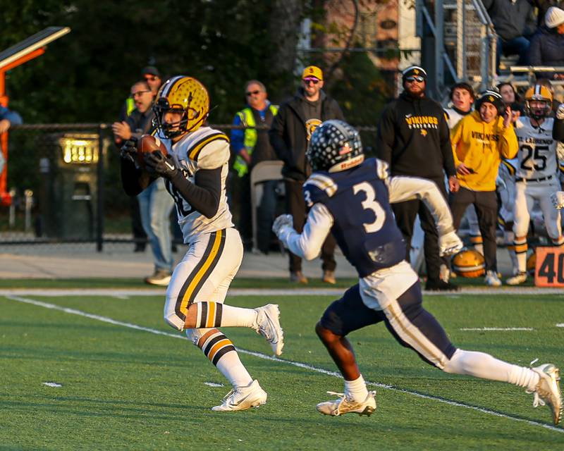 St Laurence's Kyle Richardson (40) runs in for an early touchdown after a catch across the middle during Class 4A third round playoff football game between St Laurence at IC Catholic Prep.  Nov 11, 2023.