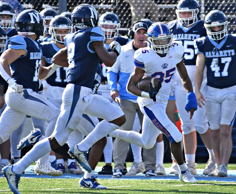 Glenbard South's Devontae Clark (35) races down the sideline for a big gain during a Class 5A second round game against Nazareth on Nov. 4, 2023 at Nazareth Academy in LaGrange Park.