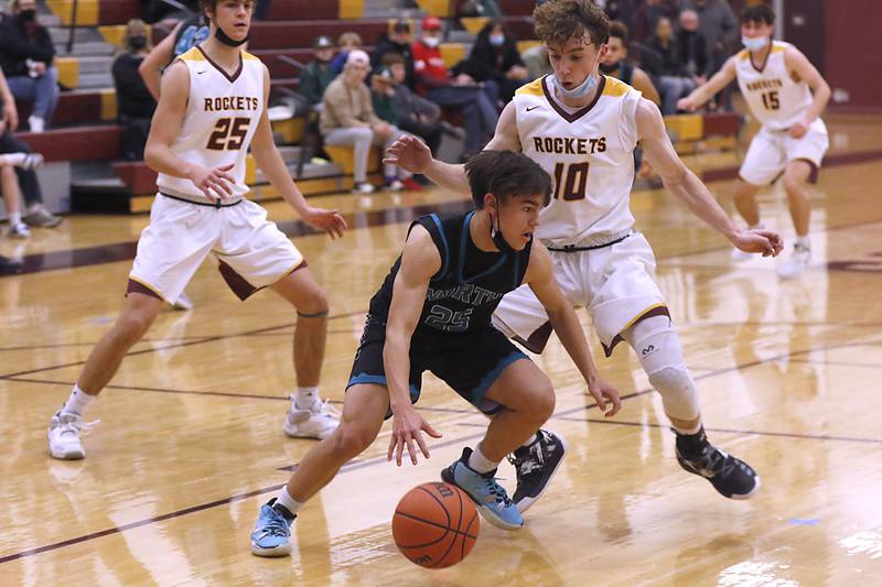 Woodstock North's Braden Luschei brings the ball up the court against Richmond-Burton's Connor Wallace the ball during a Kishwaukee River Conference game Friday, Jan. 28, 2022, at Richmond-Burton High School.