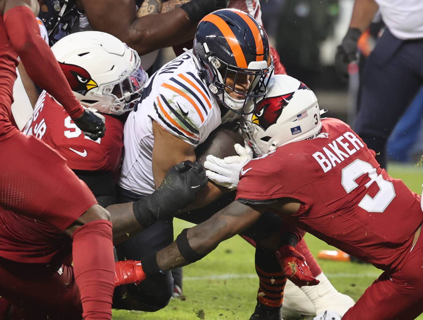 Chicago Bears running back Roschon Johnson carries the ball near the goal line as Arizona Cardinals safety Budda Baker makes the stop during their game Sunday, Dec. 24, 2023, at Soldier Field in Chicago.