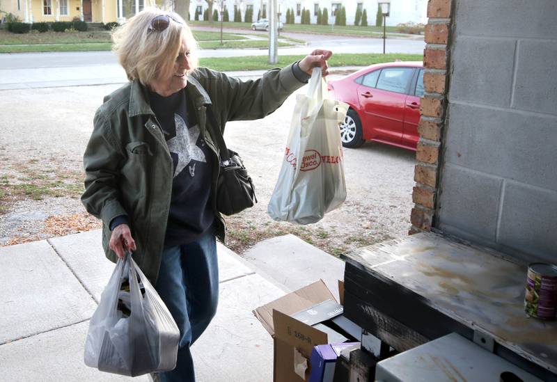 Kathy Cain, from Sycamore, drops off items for the food drive Tuesday, Nov. 12, 2024, at the Stage Coach Theatre in Dekalb. The food collected will be assembled into dinner boxes to provide local families with a Thanksgiving meal.