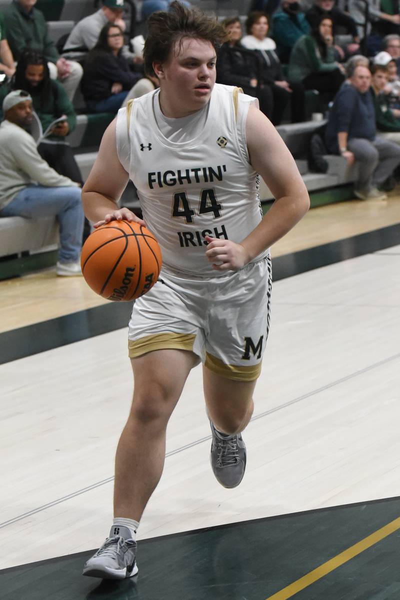 Bishop McNamara's Cale Hamilton drives to the basket during a home game against Lycee Francais de Chicago Wednesday, Feb. 18, 2026.