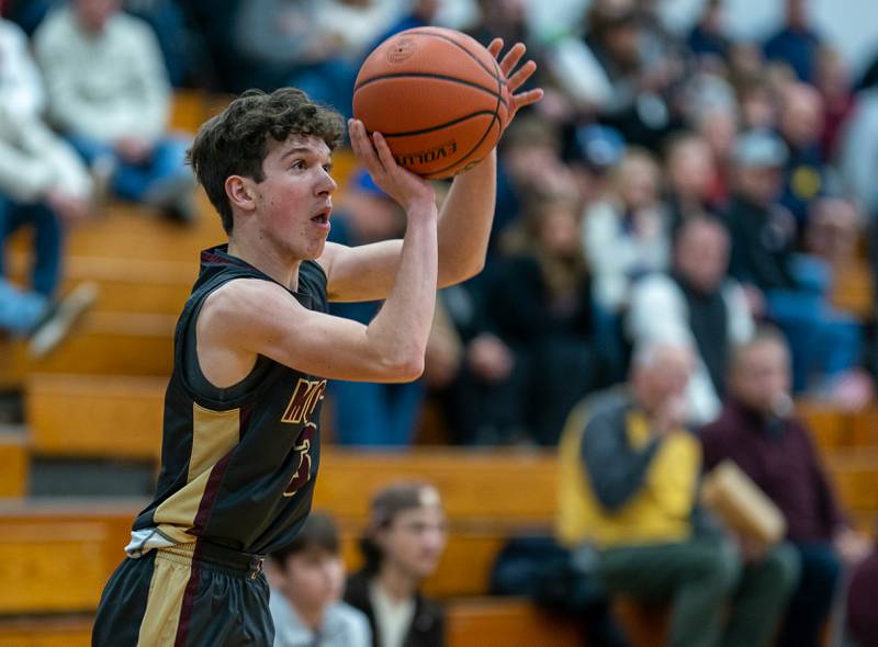 Morris’ Charlie Wright (3) shoots a three-pointer against Marmion during the 59th Annual Plano Christmas Classic basketball tournament at Plano High School on Tuesday, Dec 27, 2022.