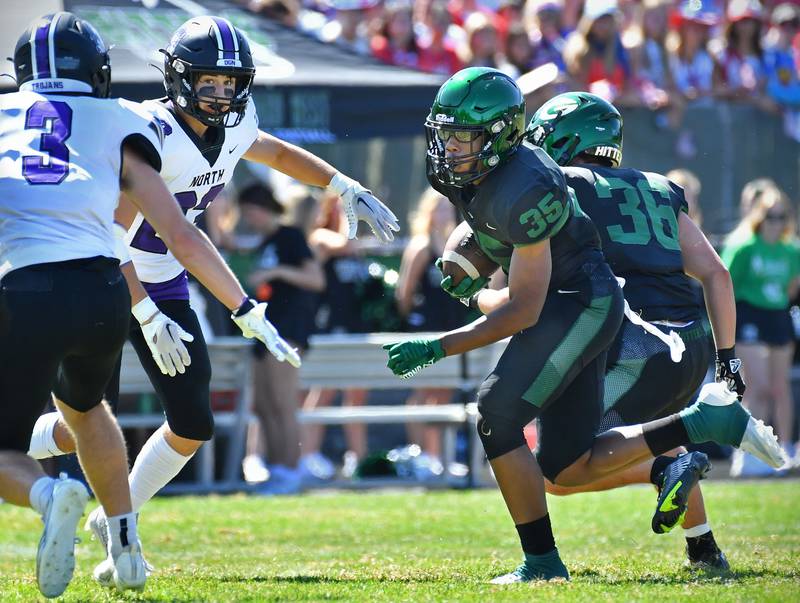Glenbard West's Xavier Nixon (35) prepares to clash with two Downers Grove North defenders during a game on Sep. 9, 2023 at Glenbard West High School in Glen Ellyn.
Jon Cunningham for Shaw Local News Network