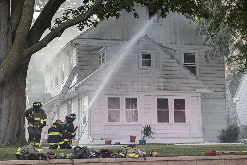 Firefighters battle a house fire Wednesday, June 26, 2024 at 1501 First Avenue in Sterling. Multiple departments responded to the scene including Sterling, Rock Falls, Dixon, Amboy, Morrison and Prophetstown.