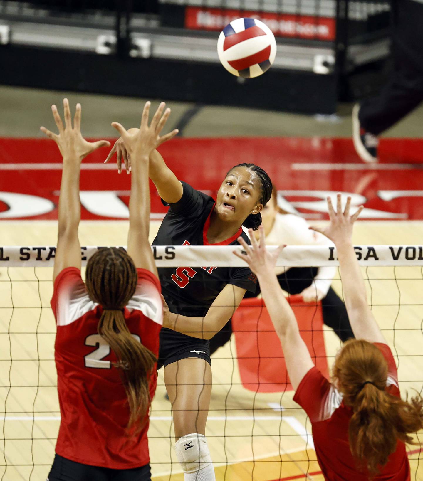 Benet Academy's Brooklynne Brass (5) pushes the ball over the net during the IHSA Class 4A girls volleyball championship match Saturday, Nov. 16, 2024 at CEFCU Arena in Normal.