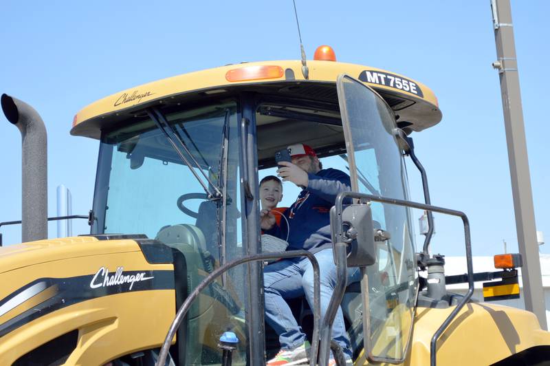 Ben Modlinger, of Forreston, takes a selfie with his 5-year-old son, Joey Modlinger, while in a Challenger MT755E agricultural crawler tractor during a Touch-A-Truck event hosted by the Forreston Lions Club and the Forreston Area Business Association in conjunction with an Easter egg hunt. The event was held on April 8, 2023, at Forreston's Memorial Park.