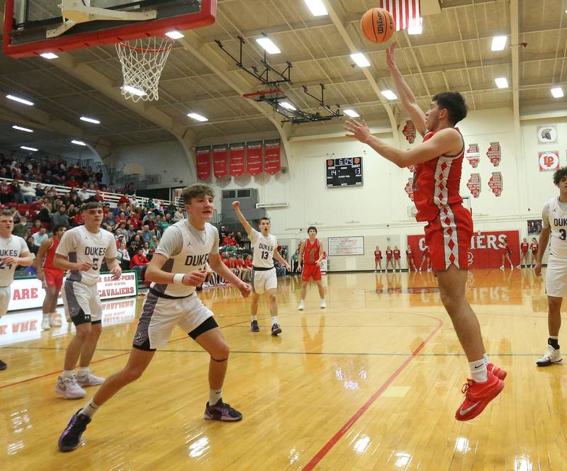 L-P's Erick Sotelo lets go of a shot in the lane over Dixon's Brody Nicklaus during the Class 3A Regional semifinal game on Wednesday, Feb. 26, 2025 in Sellett Gymnasium at L-P High School.