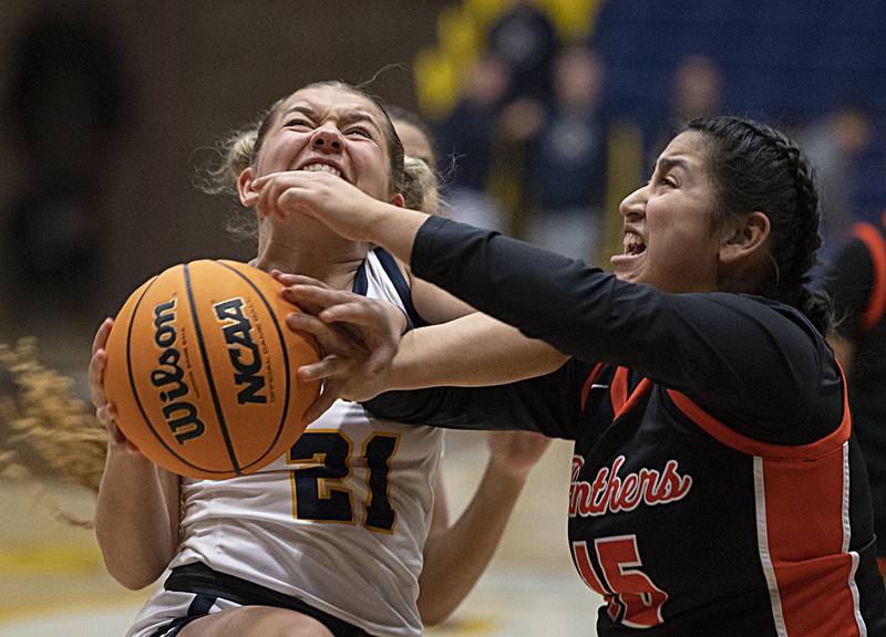 Sterling’s Jae James fights for the ball against United Township’s Annika Tristan Thursday, Feb. 6, 2025, at Sterling High School.