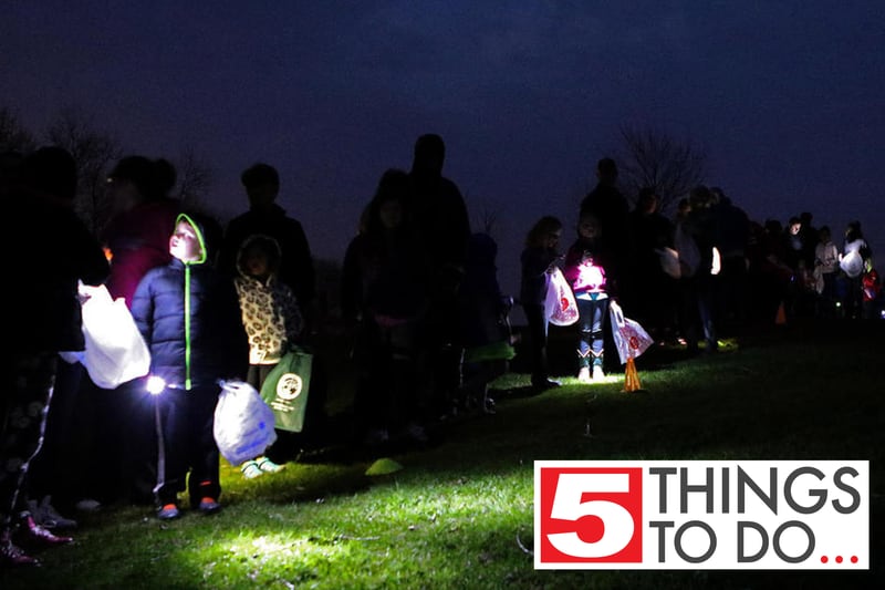 Children line up at the start with their parents before a flashlight Easter egg hunt on Thursday, April 13, 2017, at the Good Tymes Shelter part of the Sycamore Community Sports Complex in Sycamore.