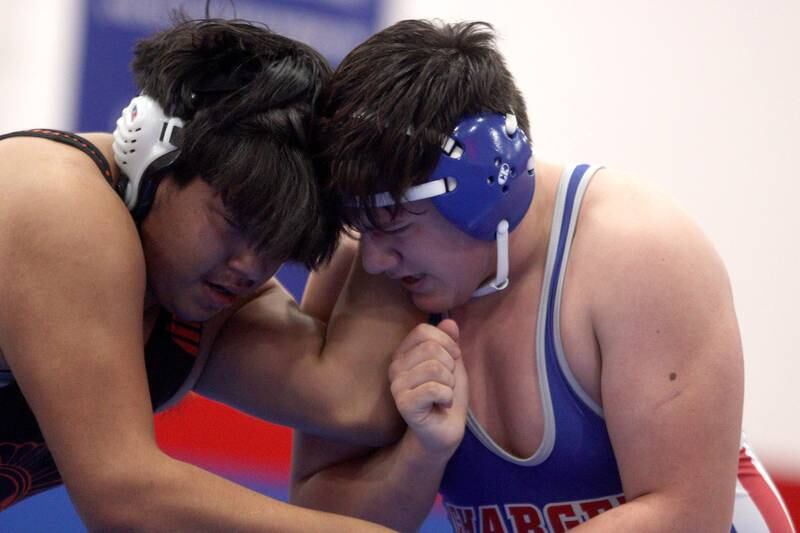 McHenry’s Luis Anacleto, left, battles Dundee-Crown’s Teigen Moreno at 220 pounds in varsity wrestling at Carpentersville Thursday night.