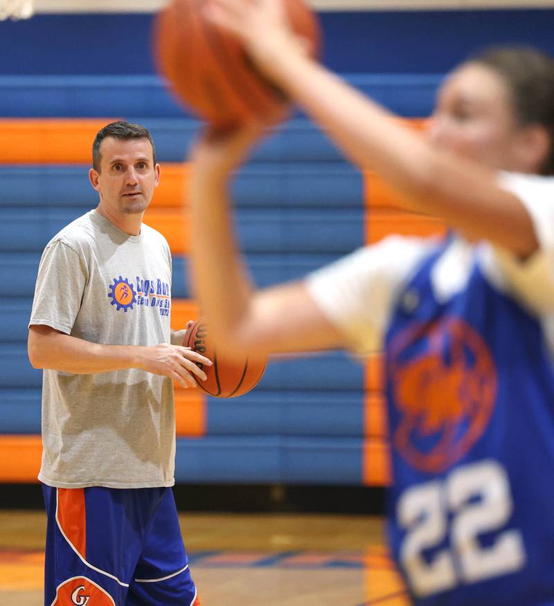 New Genoa-Kingston girls basketball coach Doug Brewington watches his players go through a drill Wednesday, June 26, 2024, during summer practice at the school. Brewington was the head girls basketball coach at Hinckley-Big Rock last year.