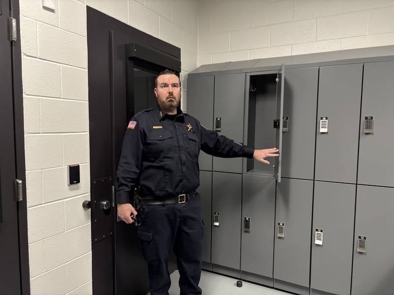 Police chief Matt Mannino shows a locker at the Lake in the Hills Police Department jail Wednesday, May, 20, 2026.
