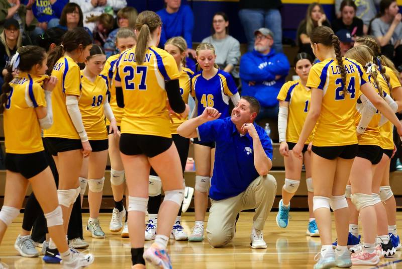 Princeton Logan coach Andy Pucks works the huddle during a timeout in Monday's Class 3A 8th grade sectional finals at Pannebaker Gym. The Lions fell in three sets to Morris Saratoga.