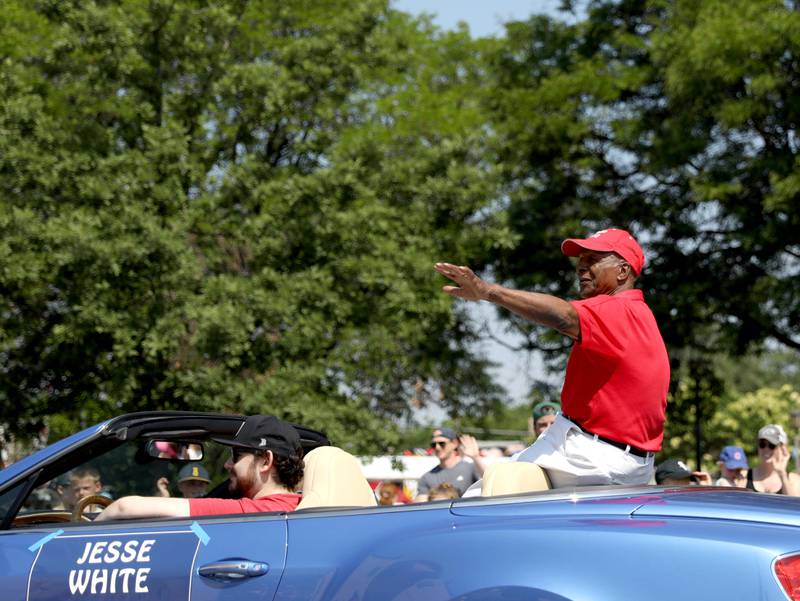Grand Marshall and former Illinois Secretary of State Jesse White waves to the crowds during the 77th Annual La Grange Pet Parade on Saturday, June 3, 2023.