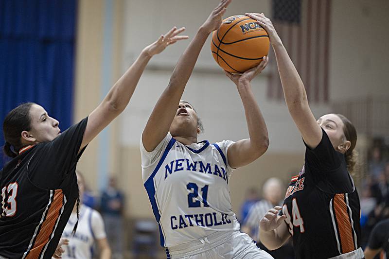 Newman’s Gisselle Martin has a shot blocked by Kewanee’s Kieryn Abernathy Thursday, Feb. 6, 2025, at Newman High School.