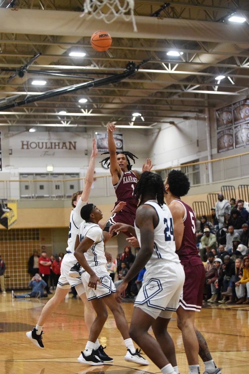 Kankakee's Lincoln Williams launches a shot at the first-quarter buzzer of the Kays' game against DePaul Prep at the Team Rose Shootout at Mount Carmel Sunday, Dec. 14, 2025.