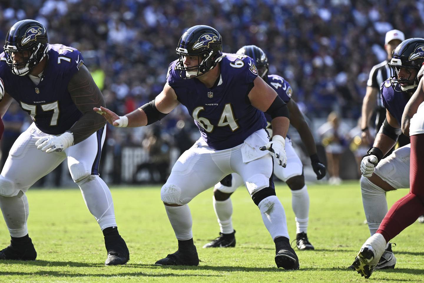 Baltimore Ravens center Tyler Linderbaum (64) in action during the second half of an NFL football game against the Washington Commanders, Sunday, Oct. 13, 2024, in Baltimore. (AP Photo/Terrance Williams)