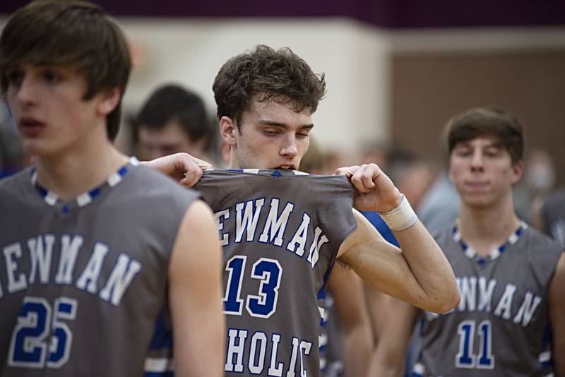 Newman's Nolan Britt walks off the court after the Comets fell to Scales Mound in the sectional final Friday, March 4, 2022.