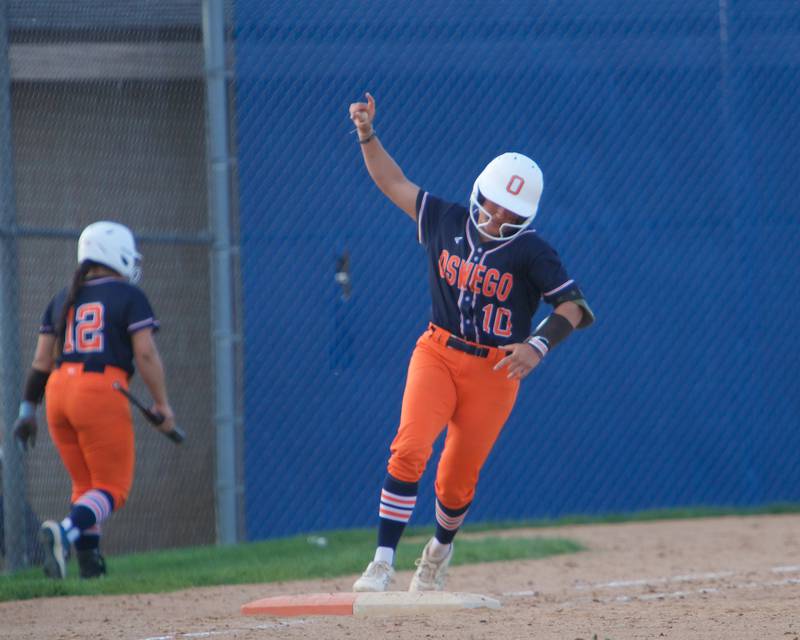Oswego's Kiyah Chavez rounds first after hitting a homer in the top of the seventh inning against Wheaton North on Tuesday May 6, 2025 in Wheaton.