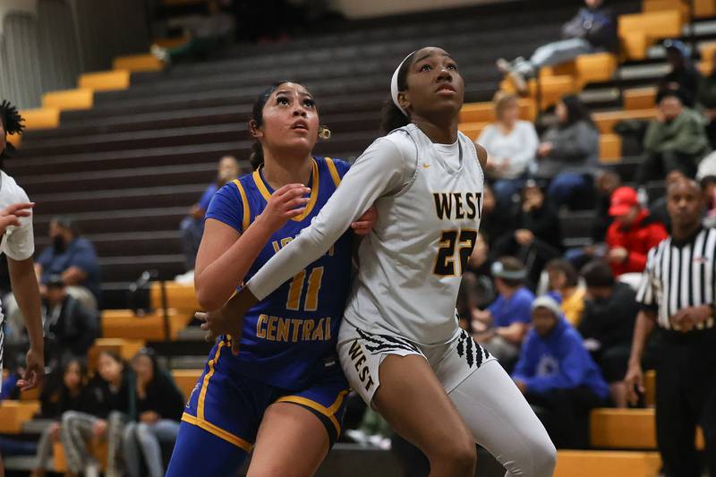 Joliet Central’s Alycia Bittle and Joliet West’s Makayla Chism position for the rebound on Thursday, Jan 30, 2025 in Joliet.