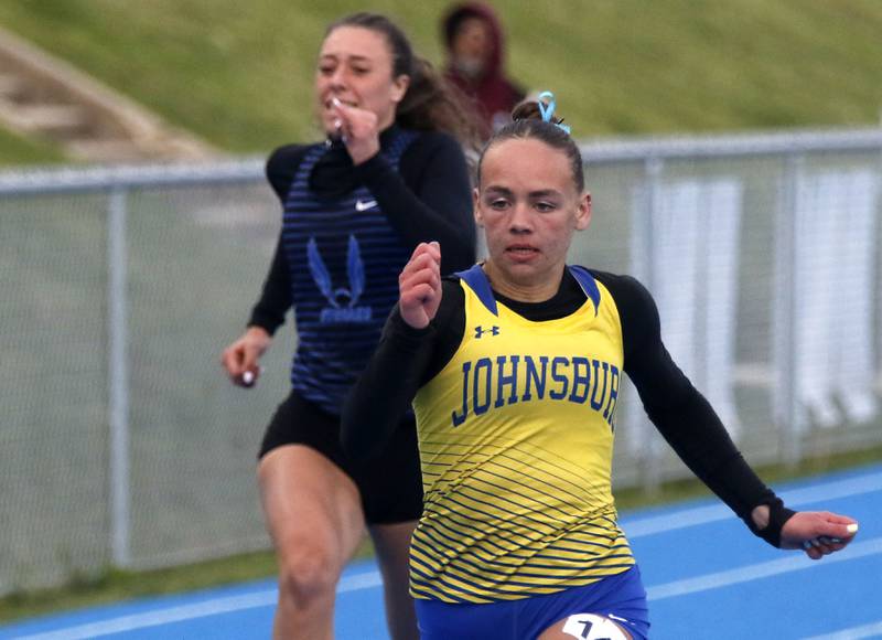 Johnsburg’s Hope Klosowicz wins the 100 meter dash during the Kishwaukee River Conference Girls Track and Field Meet on Tuesday, May 5, 2025, at Woodstock High School.