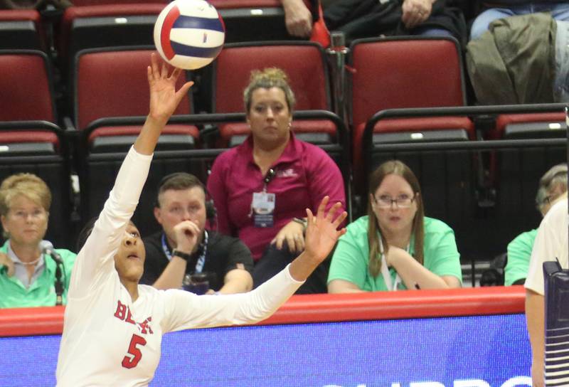 Benet Academy's Brooklynne Brass sends the ball over to Huntley during the Class 4A State semifinal game on Friday, Nov. 15, 2024 at CEFCU Arena in Normal.