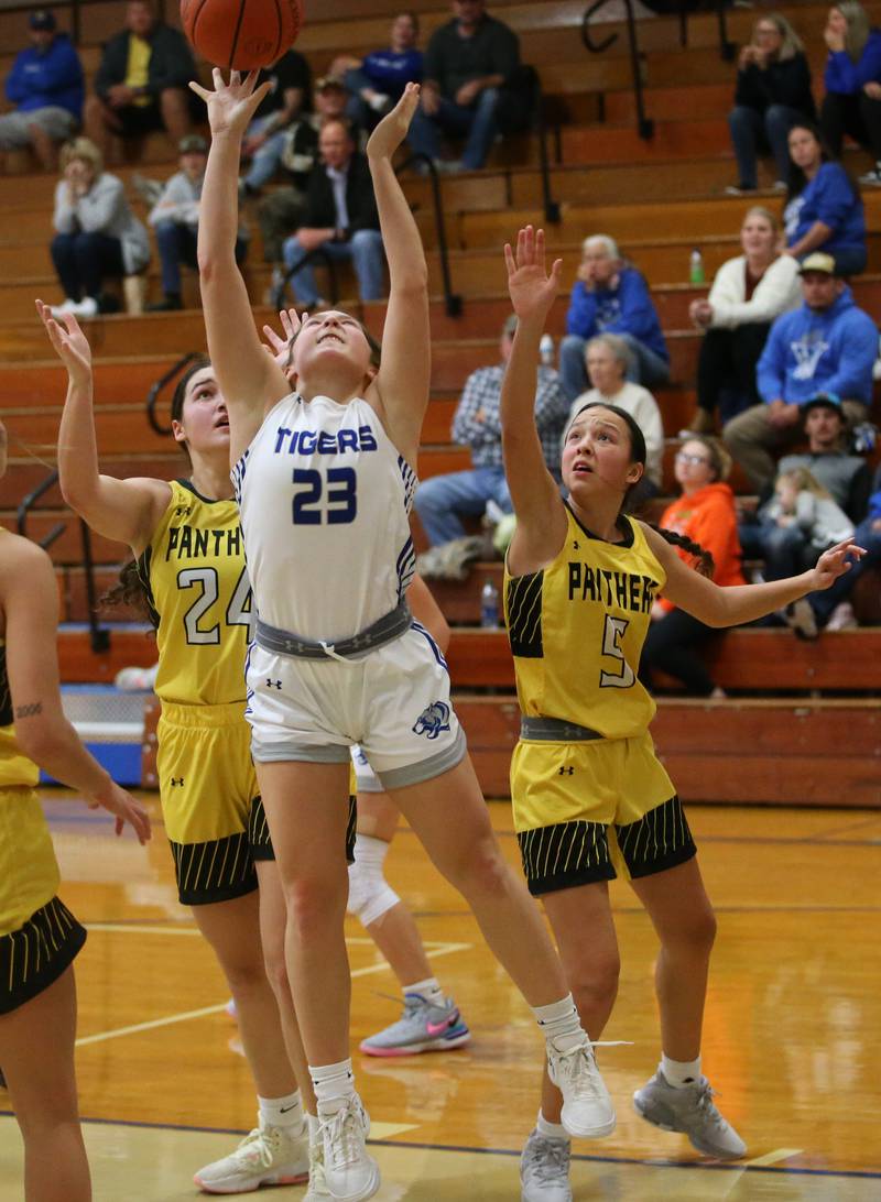 Princeton's Miyah Fox cuts in the lane to shoot a layup over Putnam County's Maggie Richetta and teammate Eme Bouxsein during the Princeton High School Lady Tigers Holiday Tournament on Thursday, Nov. 16, 2023 at Prouty Gym.